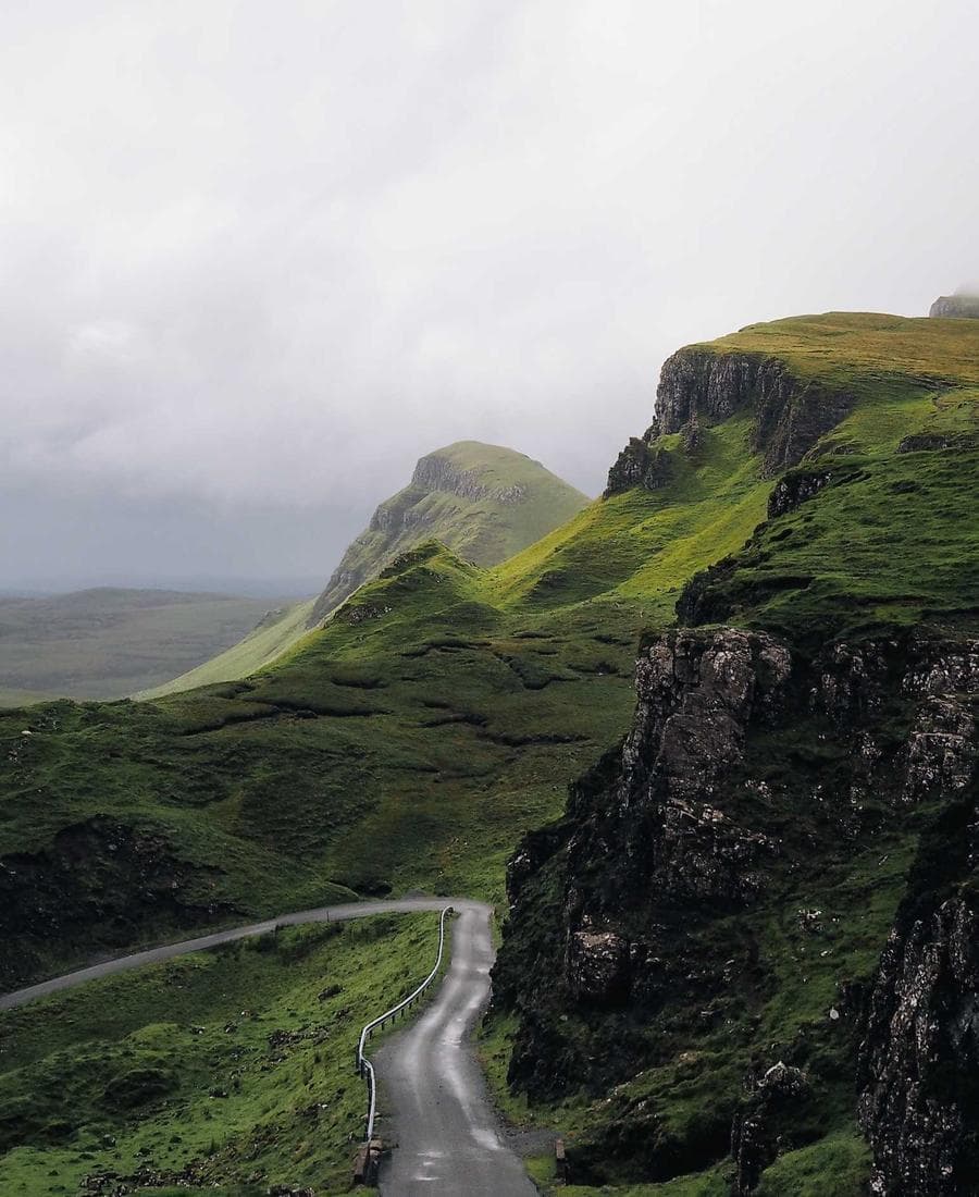 A road winding through green highlands